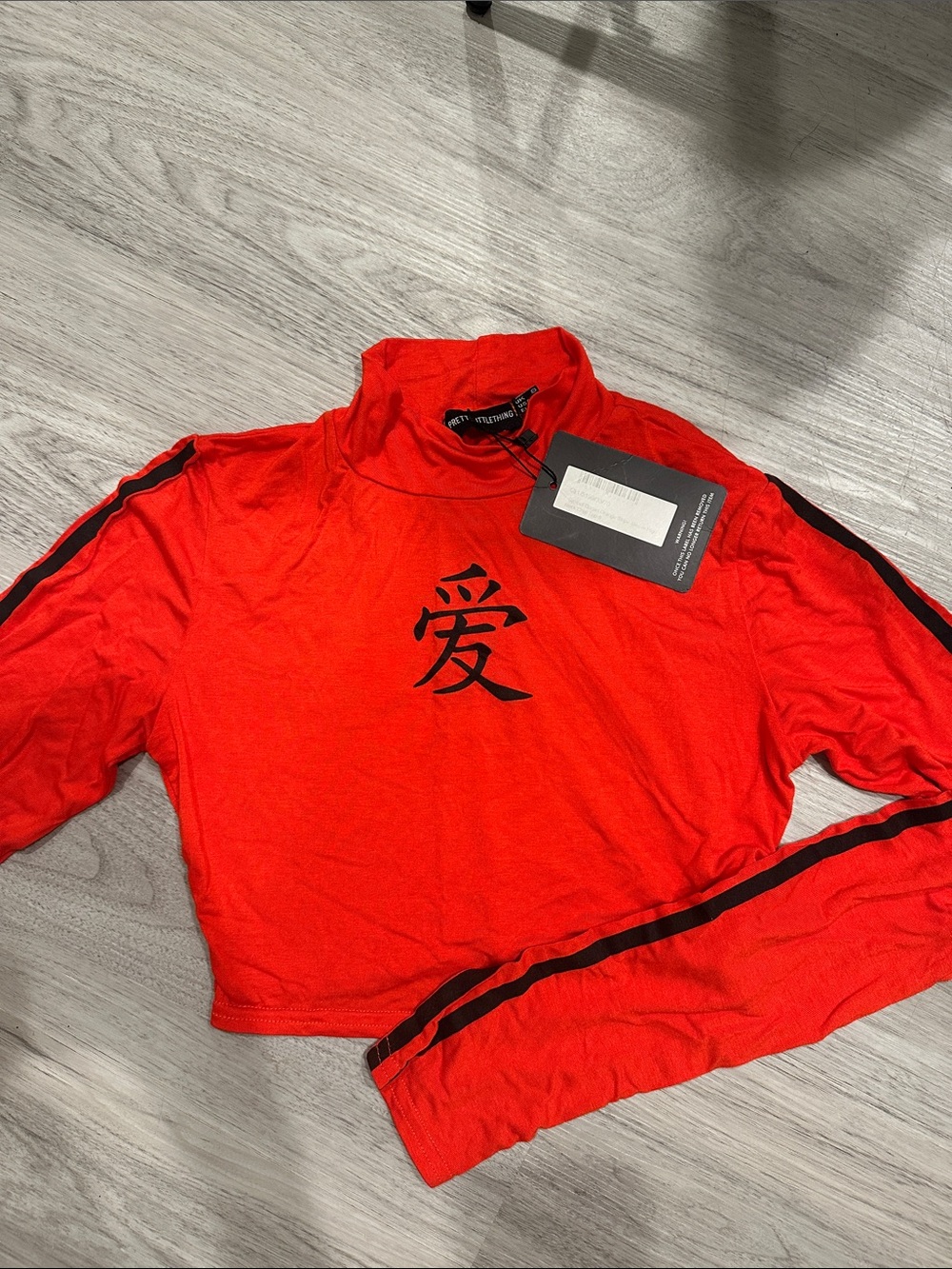 PrettyLittleThing Red Long Sleeve Crop Top with Black Script